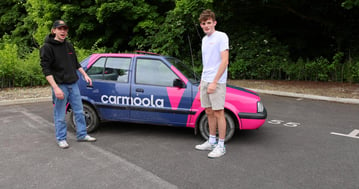 Finn and Rafe with their Carmoola-branded Nissan Micra