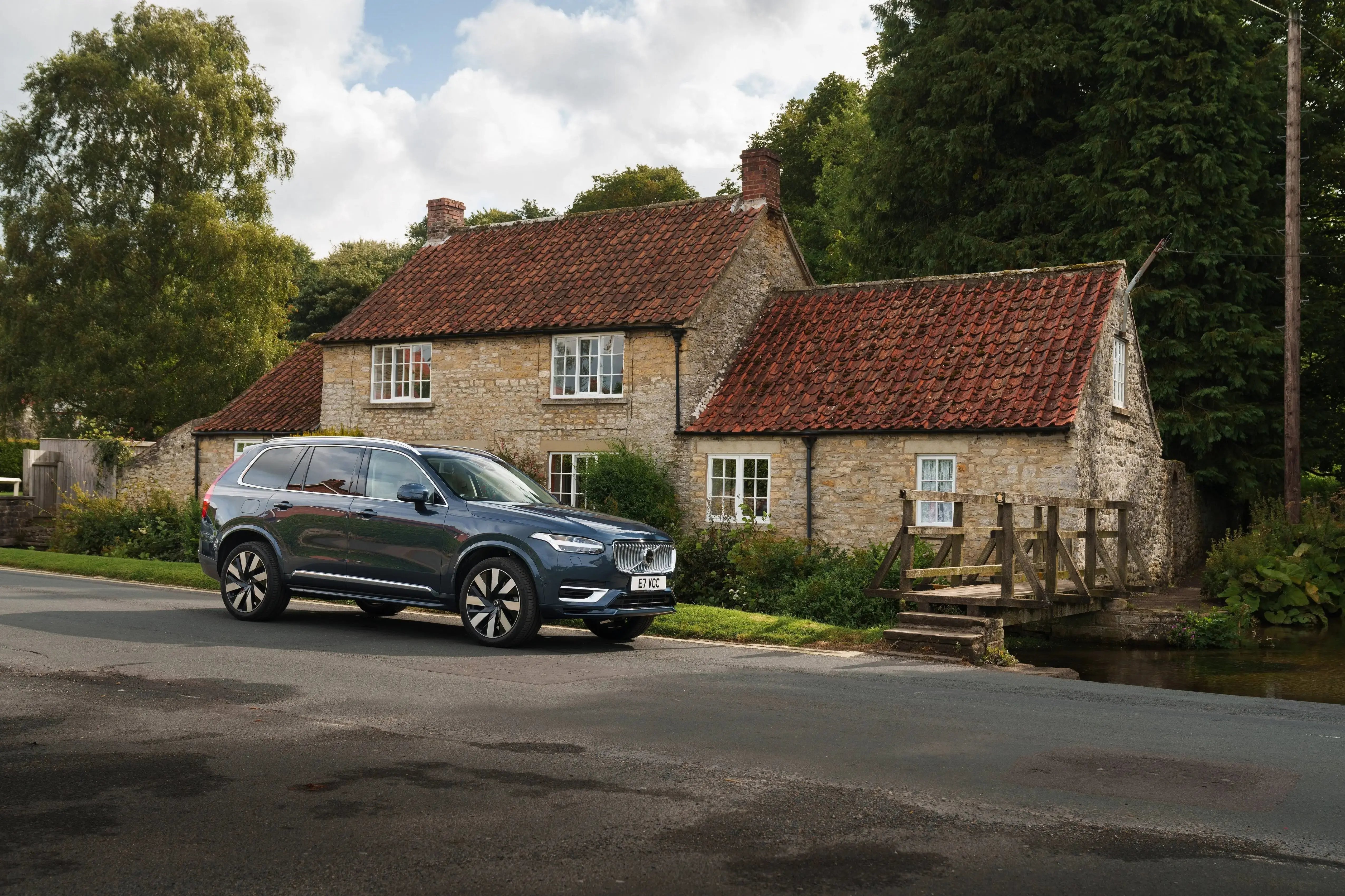 black-Volvo-XC90-parked-country-home