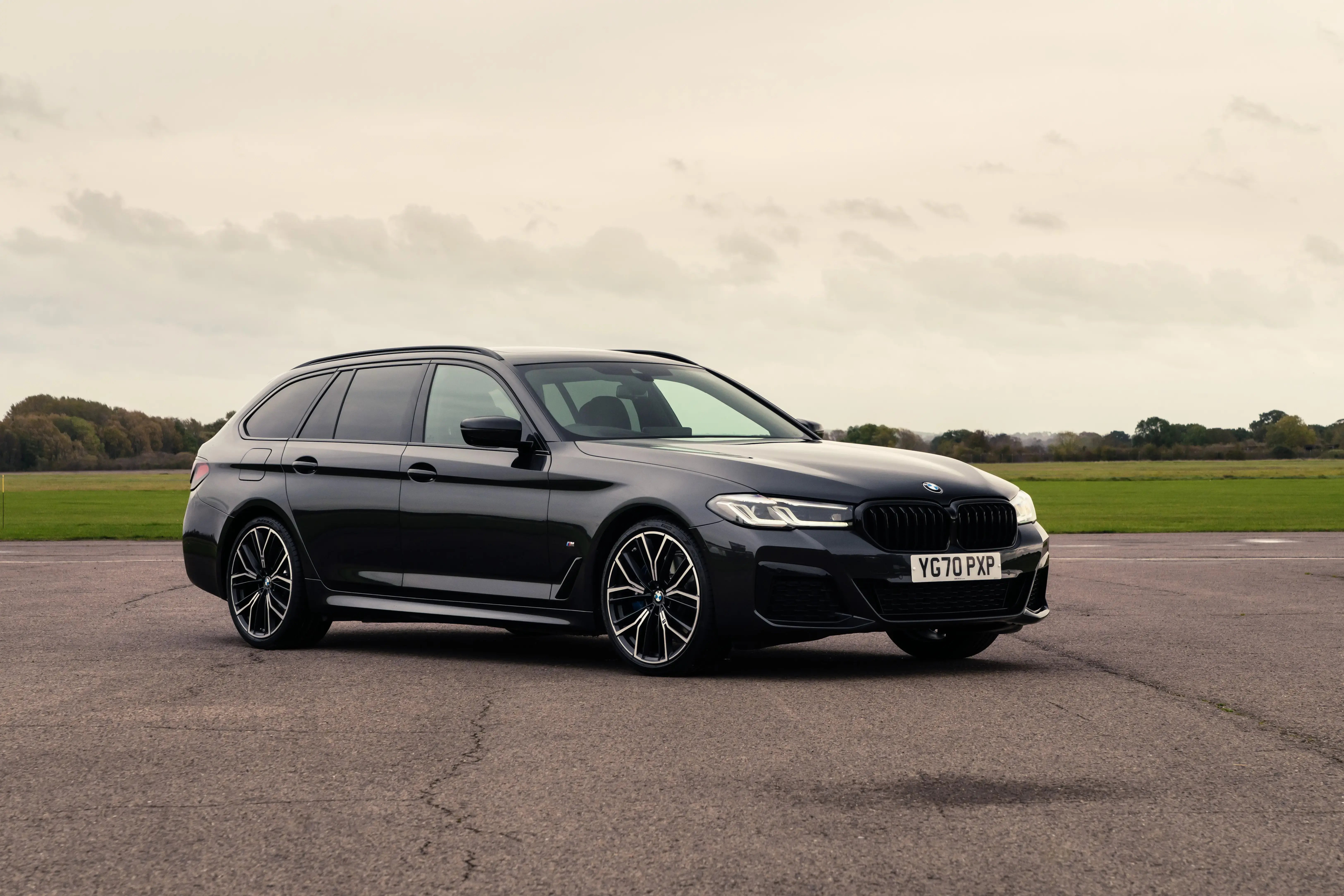 black-bmw-520d-touring-parked-front