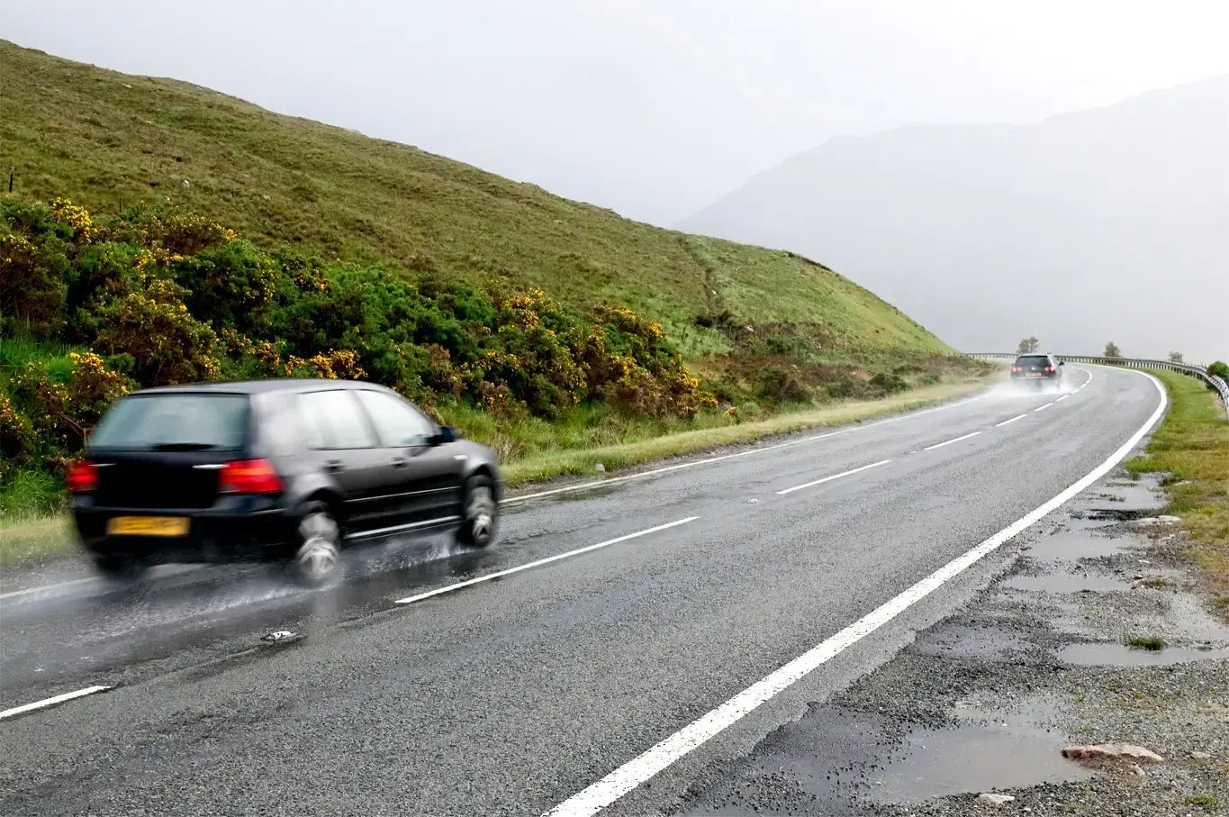 car-wet-winding-road