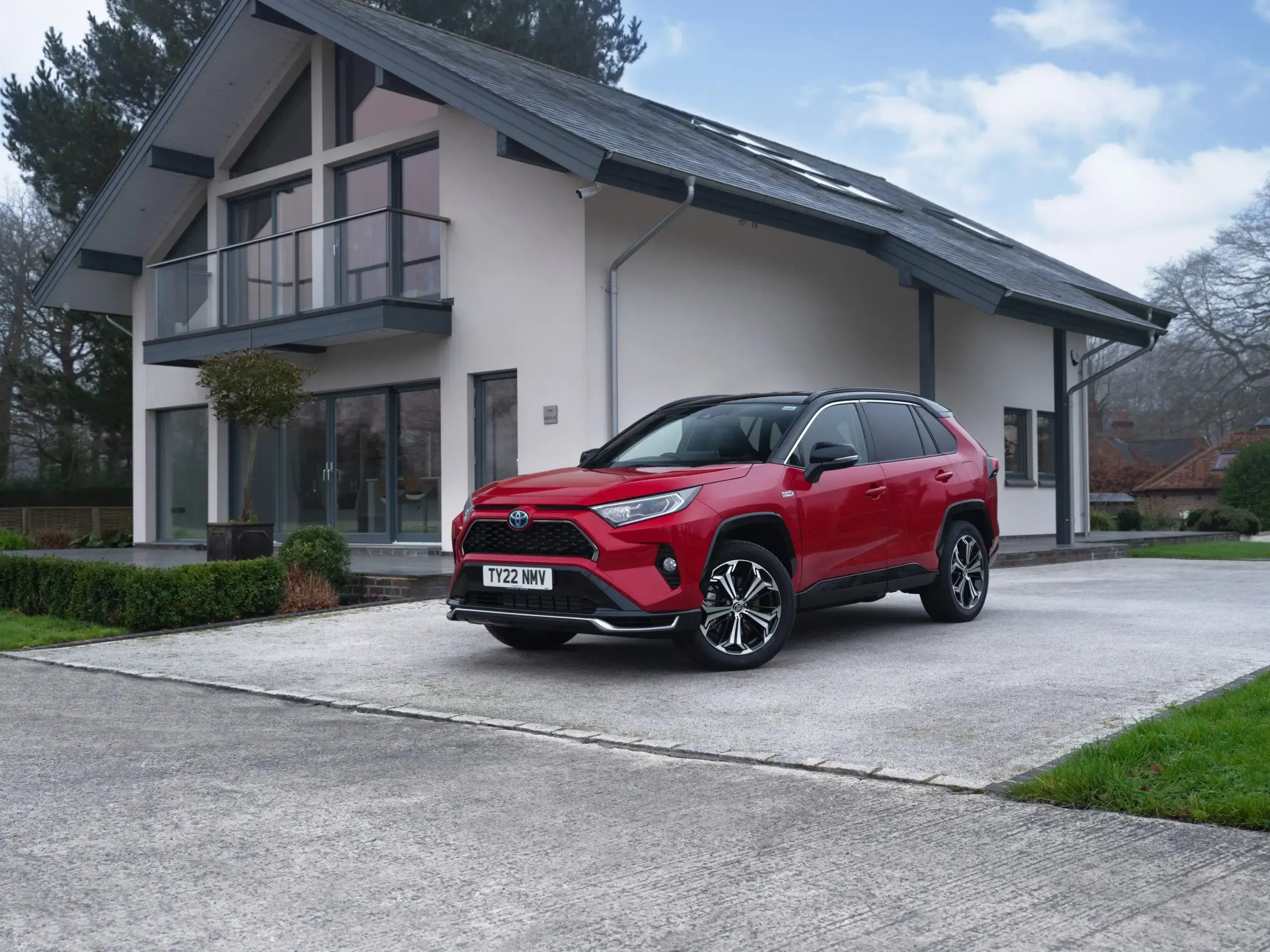 red-Toyota-RAV4-PHEV-driveway