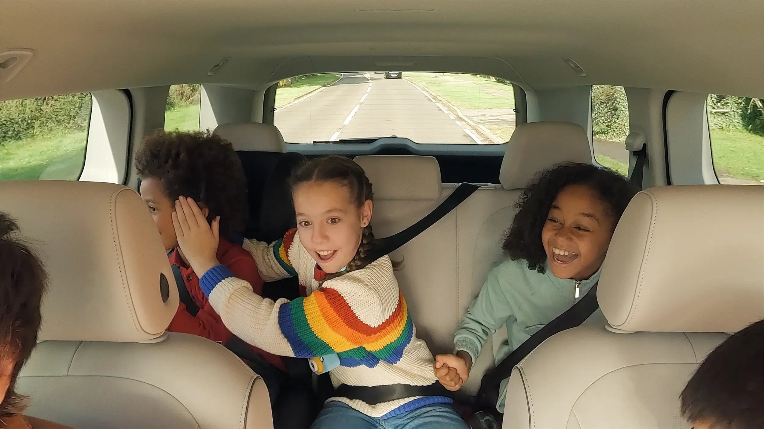 three-kids-on-backseat